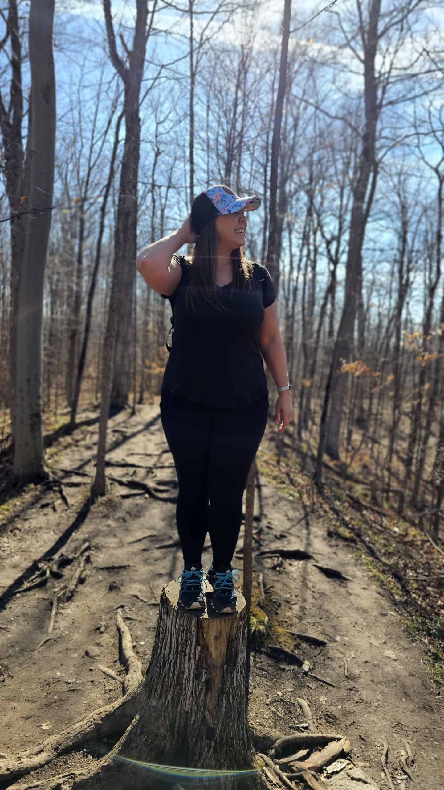 Lauren standing on a log at Starkey Hill